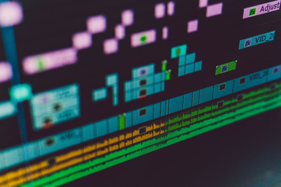 A multi-track video editing timeline in editing software, showing stacked video and audio clips