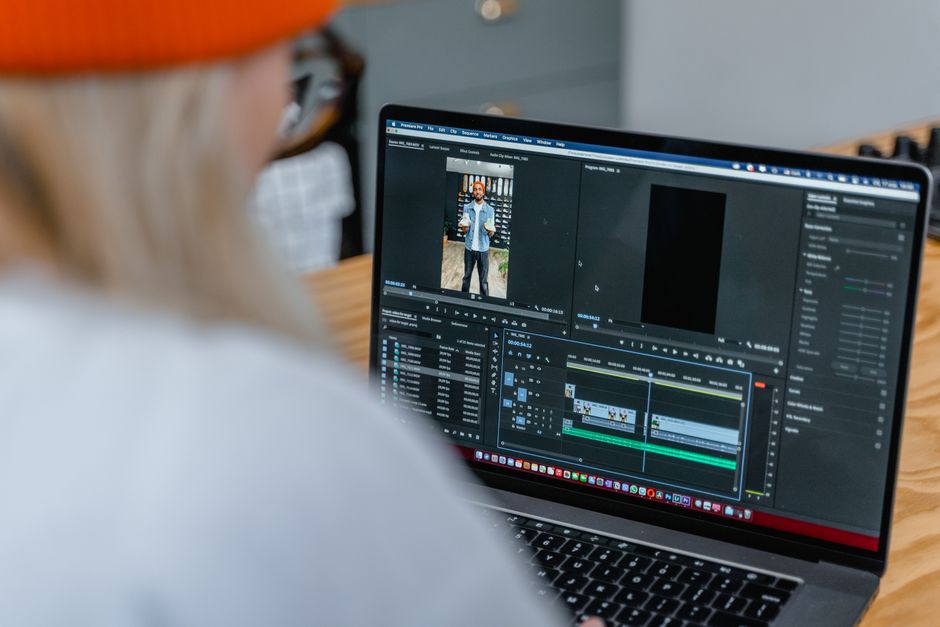 A person reviewing a vertical video clip on a laptop editing timeline